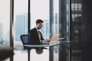 Businessman working in executive office in a skyscraper