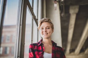 Portrait young female in loft apartment
