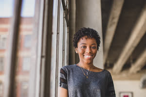 Portrait of young african american female looking to camera