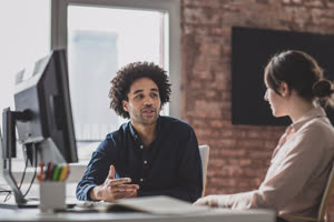 Coworkers in a casual meeting discussing work