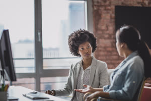 Coworkers in a discussion in an office