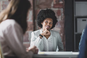 African American businesswoman listening in a meeting