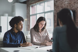 Smartphone app developers in a business meeting