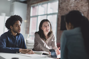Smartphone app developers in a business meeting