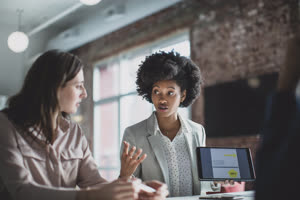 African American businesswoman leading a meeting