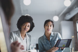 Businesswomen presenting to a client
