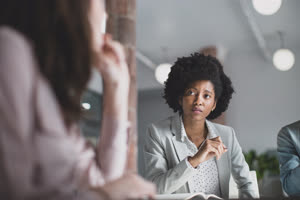 African American businesswoman listening in a meeting