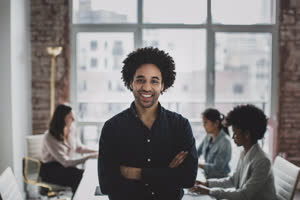 Portrait of African American businessman with his employees