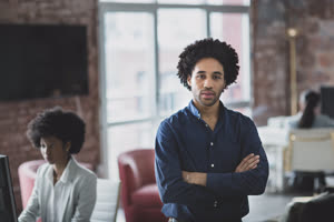 Portrait of African American businessman in a working office